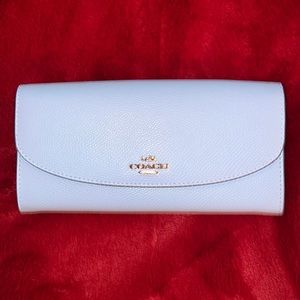 Coach light blue wallet. Brand new never been used.